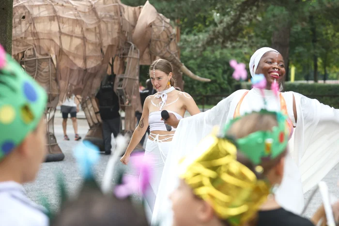 Hiheme performs in front of life-size elephant figures at the 'Celebration Parade' at the Landschaftspark Duisburg-Nord