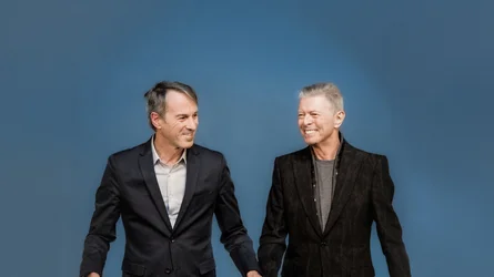 Ivo Van Hove with David Bowie against a blue background