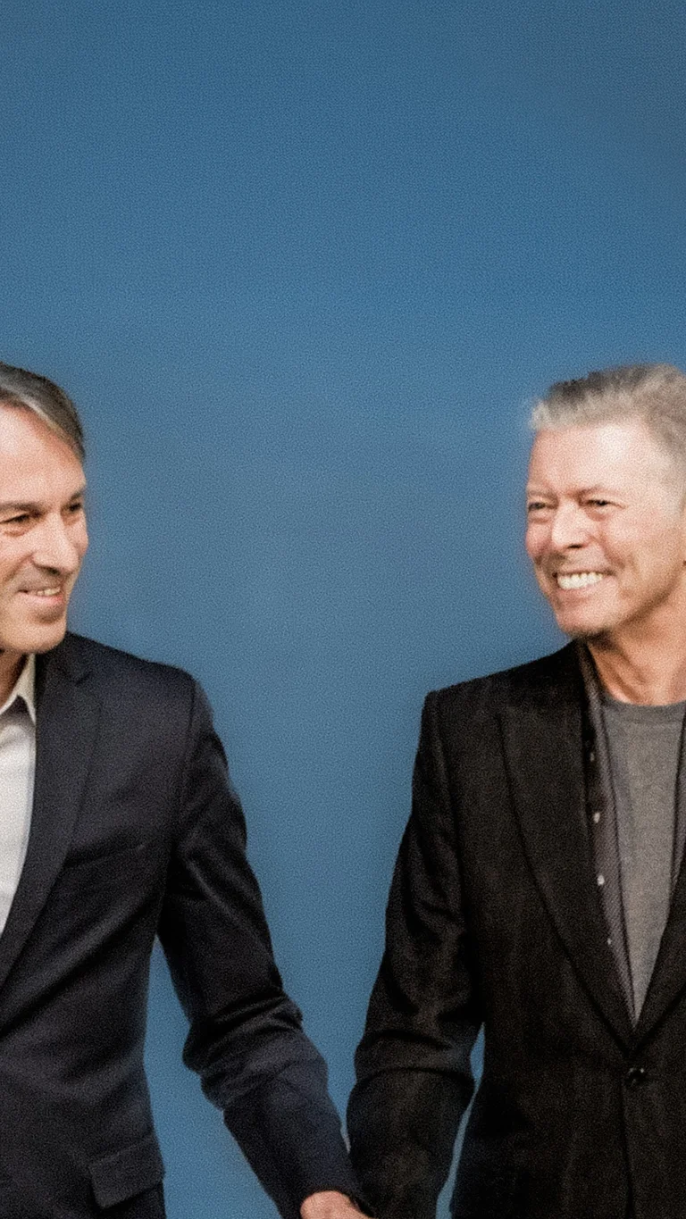 Ivo Van Hove with David Bowie against a blue background