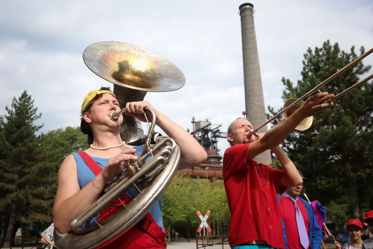 Two musicians play their instruments