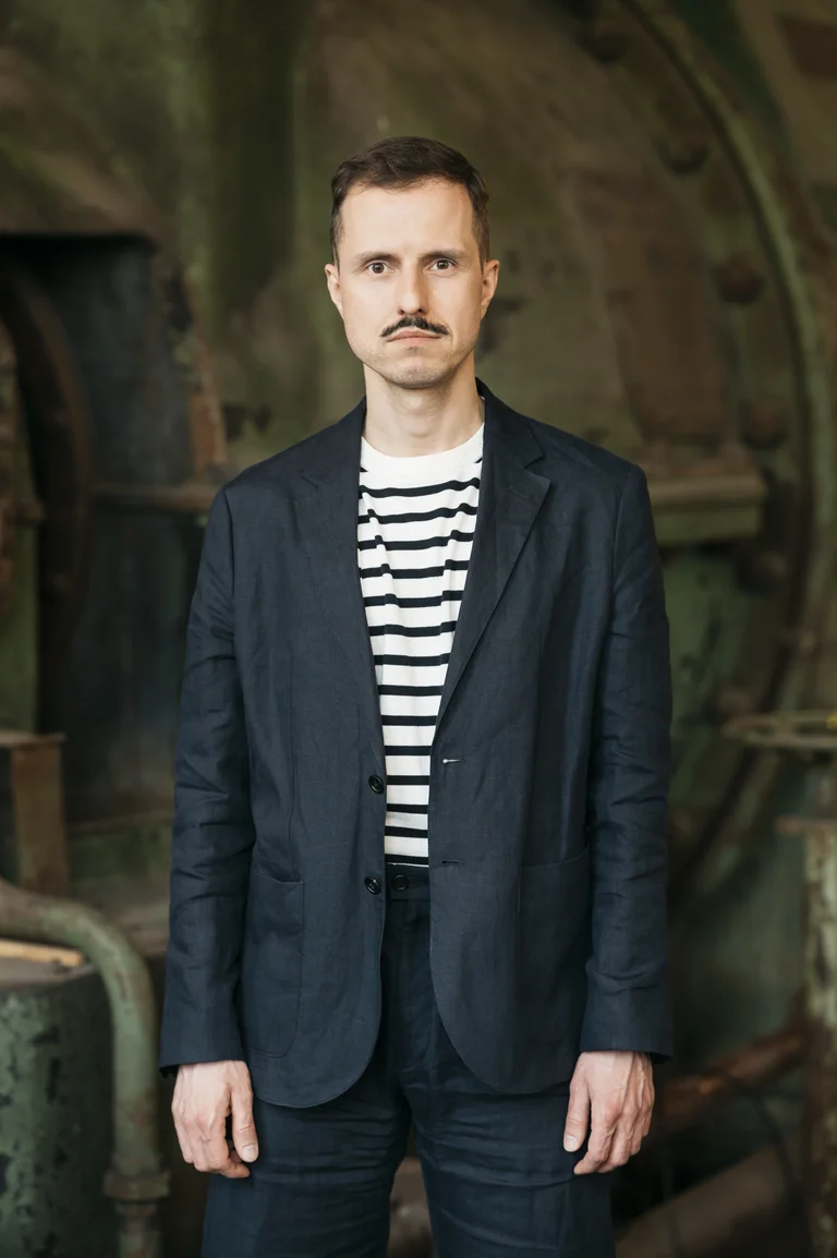 Krystian Lada, Director of Artistic Programme of the Ruhrtriennale 2024-2026, in industrial setting