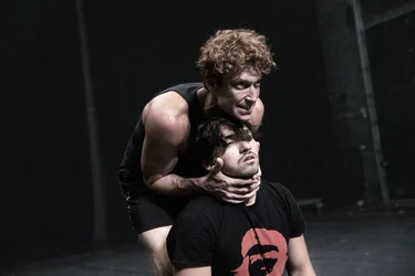 Daniel Donskoy is standing behind Diego Rodriguez and has his hands around his neck.