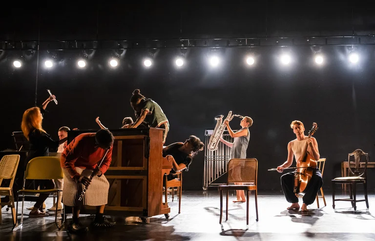 Musicians on a stage playing different instruments