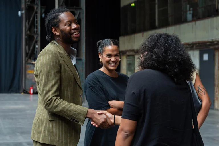 Jeremy O. Harris shakes hands with audience members after his lecture in the Jahrhunderthalle in Bochum